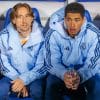 Luka Modric sits next to Jude Bellingham on the Real Madrid bench.