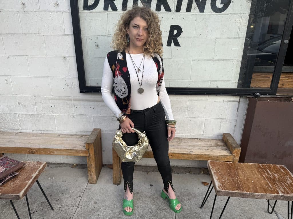 An image of a woman posing to show her outfit