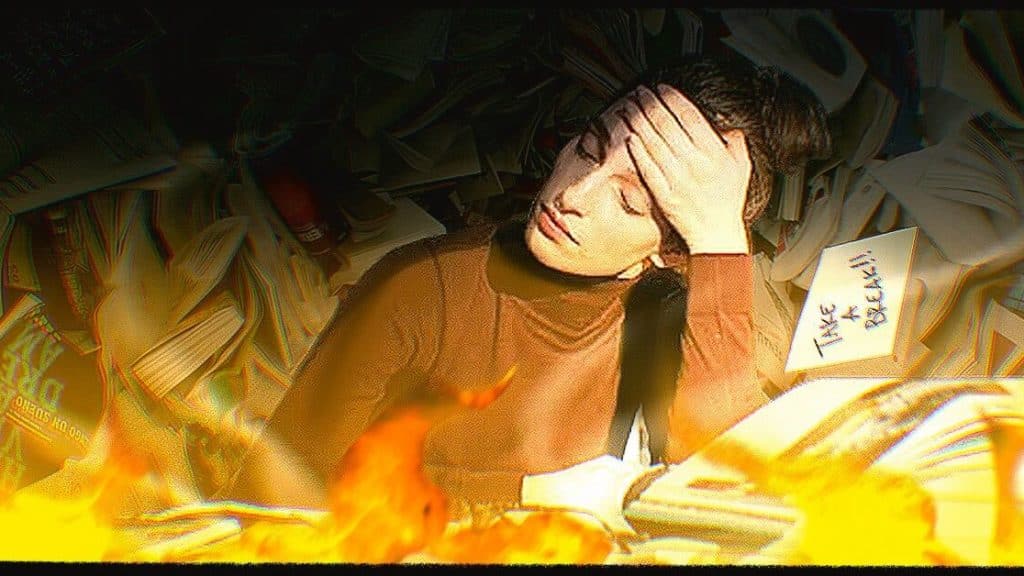 A woman at her desk is surrounded by the tasks she needs to do.