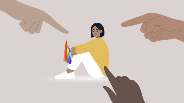 fingers point accusatorially at an LGBTQ+ woman