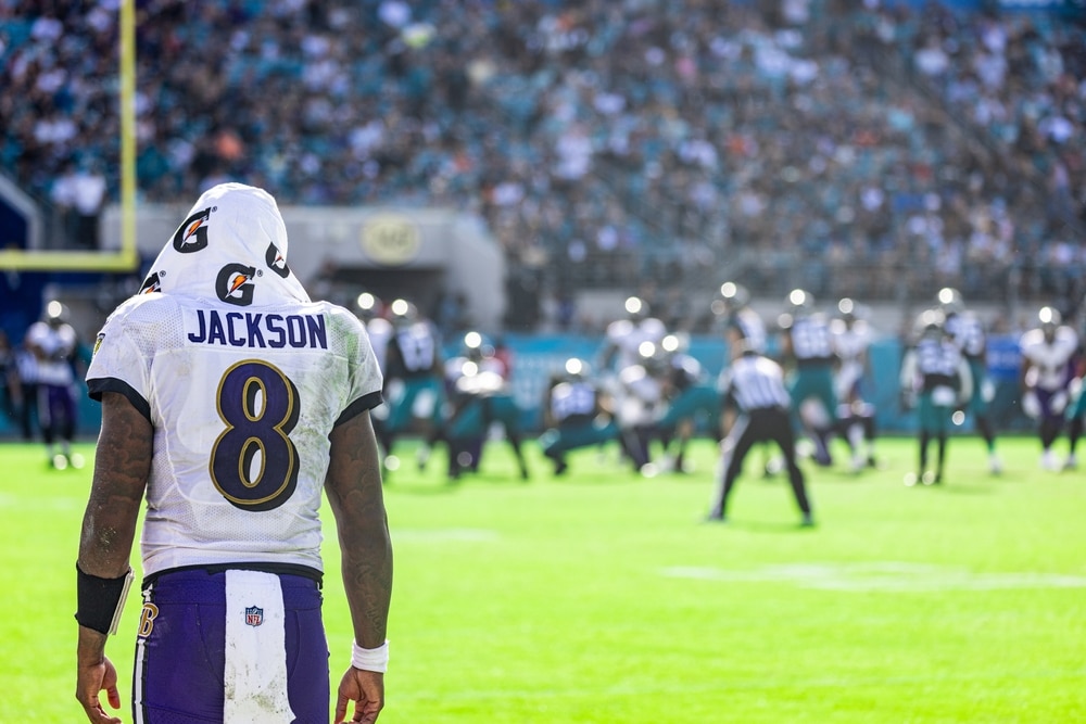 Ravens quarterback Lamar Jackson looks on as his defense takes the field.