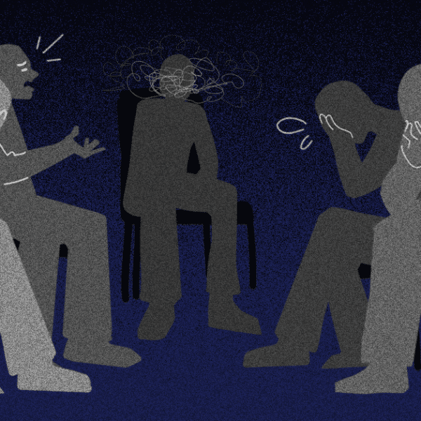 Five people sitting around in a circle. Four of them are visibly reacting with grief. While the center one has negative spirals over their face.