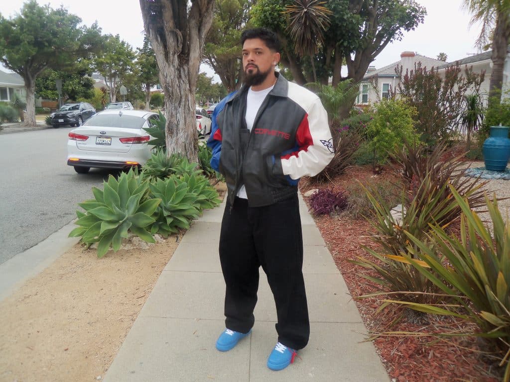 An image of a man showing off his casual outfit