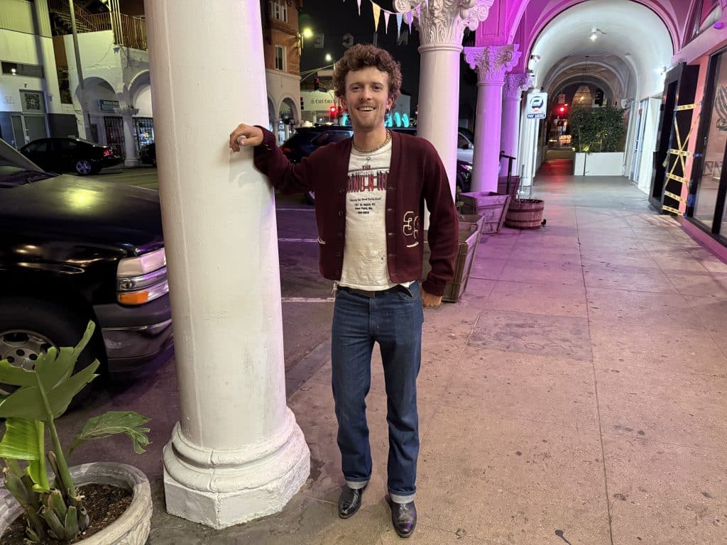 An image of the lead singer of Truckbox, posing to display his outfit