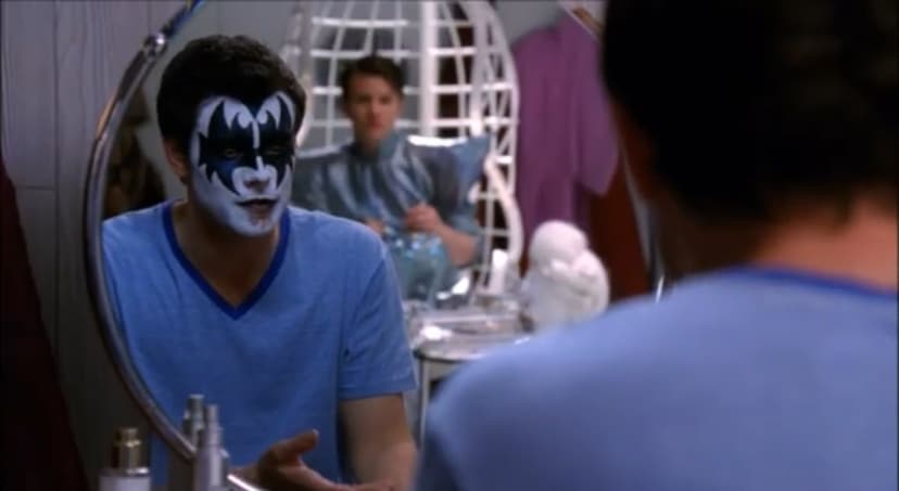 Finn Hudson looks in the mirror as he's dressed like a Kiss member.