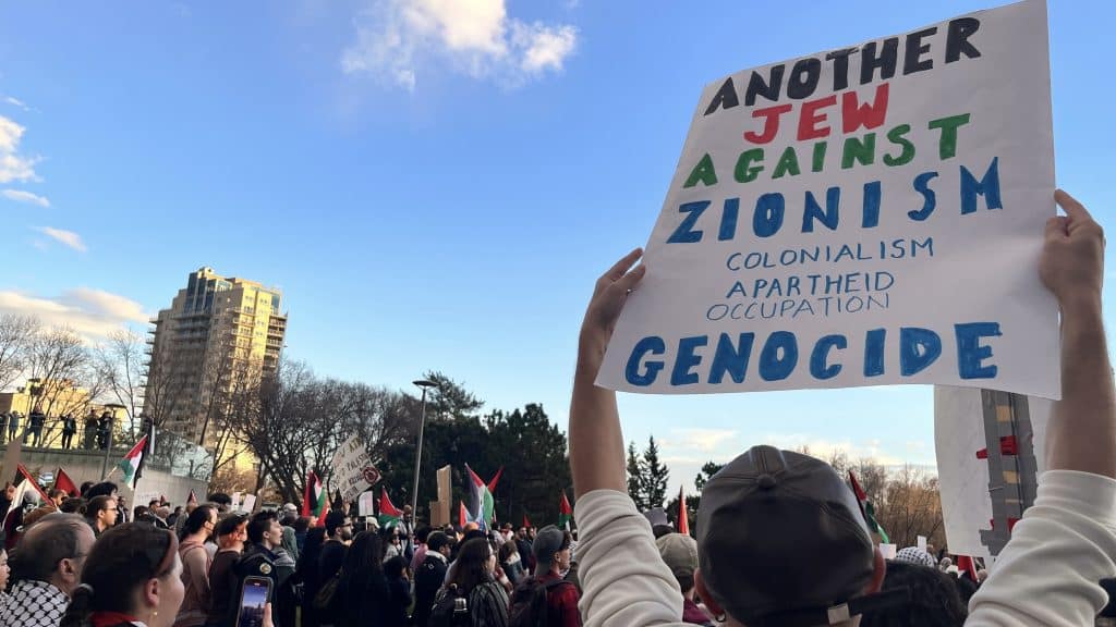 Jewish person supports Palestine at a Protest in Edmonton, Canada. Shutterstock/Jenari
