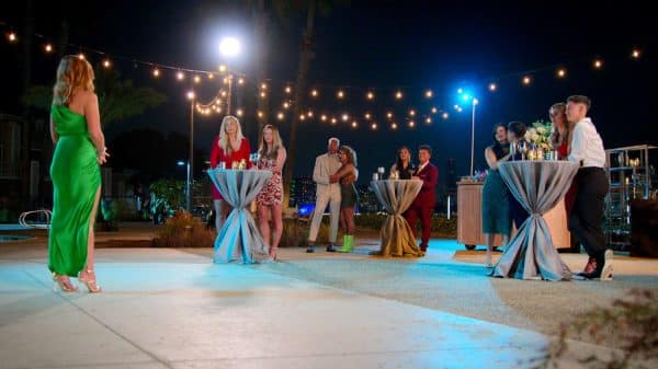 The cast of The Ultimatum: Queer Love gather together in front of host JoAnna Garcia Swisher.