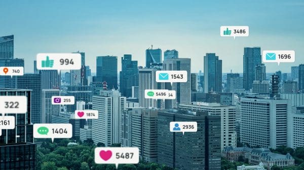 Hearts, likes, and comment bubbles float over a city skyline.