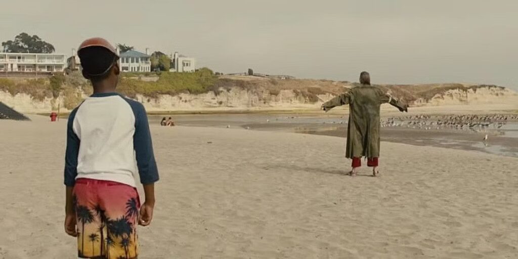 Jason (Evan Alex) sees a strange and bloody man on the beach in Us. 