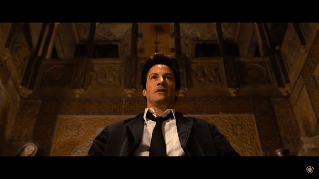 John Constantine (Keanu Reeves) sitting down