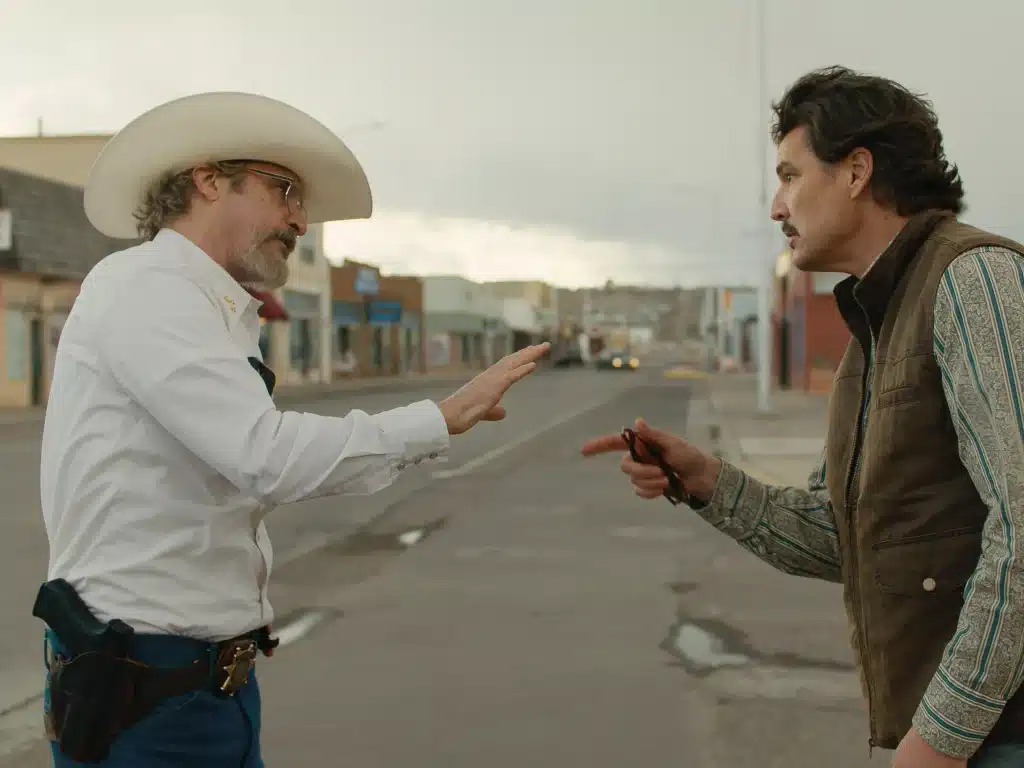 Joaquin Phoenix and Pedro Pascal argue on the streets. Credit: A24