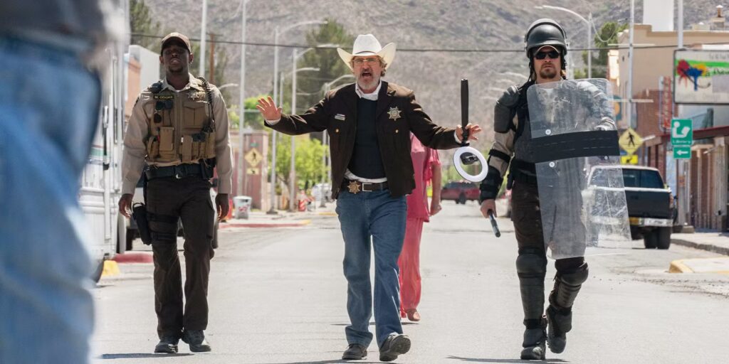 Michael Ward, Joaquin Phoenix, and Luke Grimes approach a riot. Credit: A24.