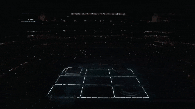A dark football field flashes with four alternating symbols: an X, a circle, a square, and a triangle