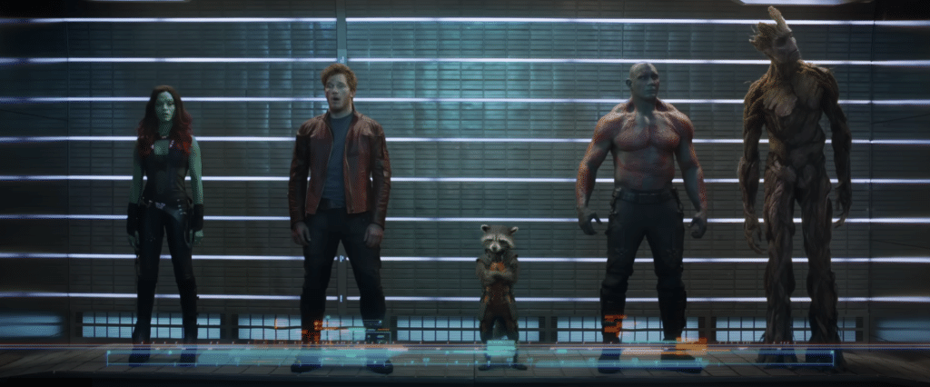 The 5 members of the guardians of the galaxy stood in a line formation, looking shocked.