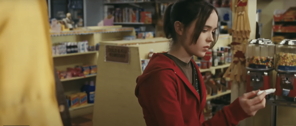 Girl in store purchasing pregnancy test.