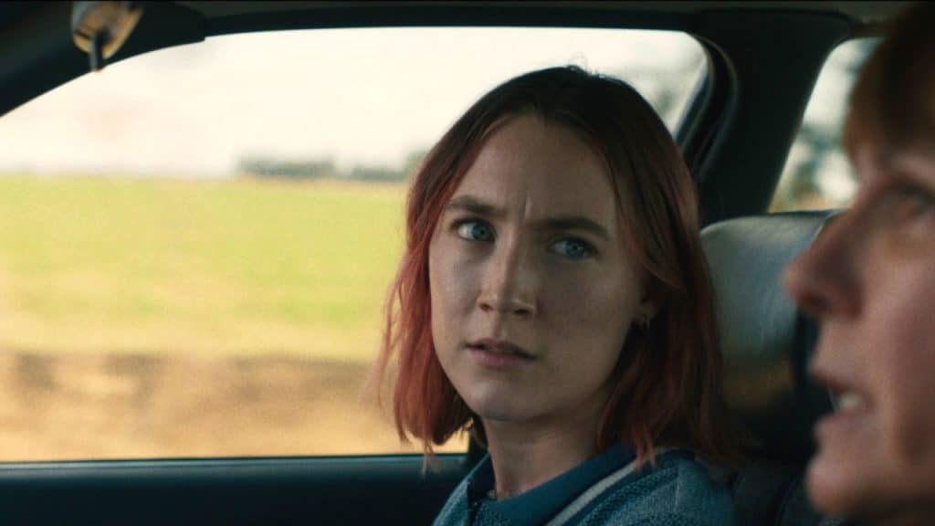 Lady Bird looks at her mom in the car