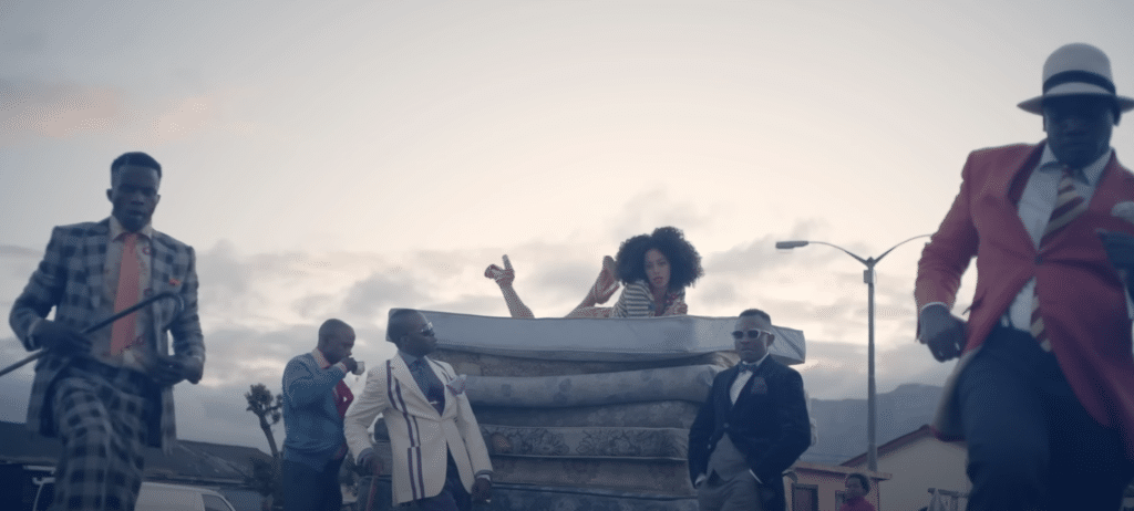 Solange is sitting on a pile of mattresses in her music video for Losing You