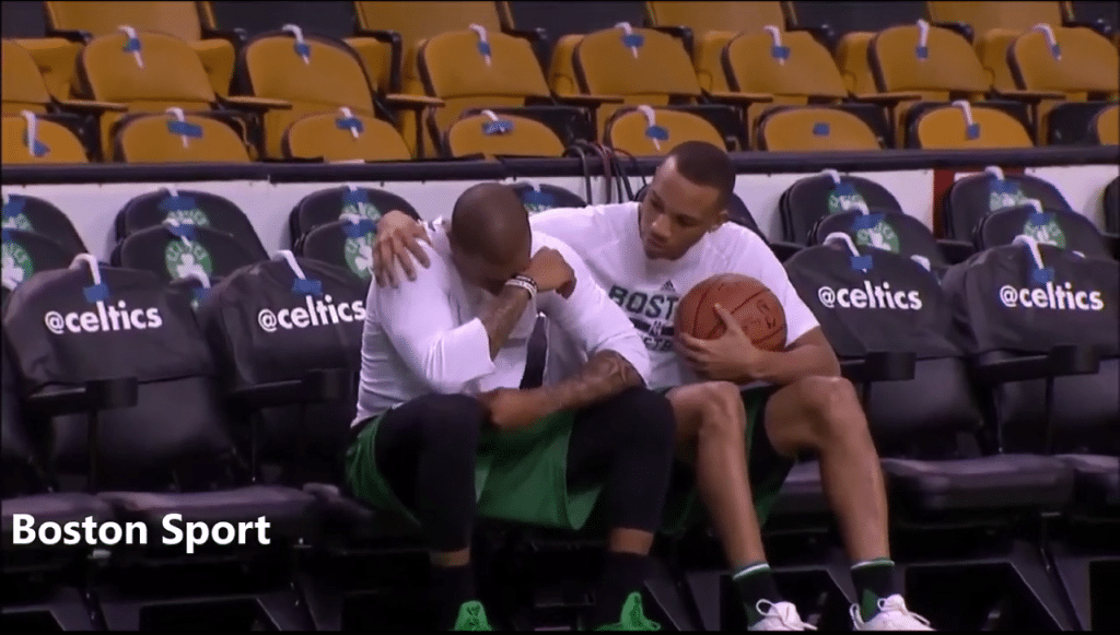 Teammate Avery Bradley consoling Isiah Thomas after the passing of his sister.