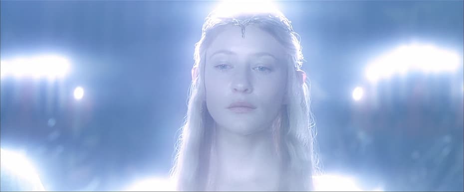 Galadriel looking ethereal, and eternal. She looks angelic, more than human. In the article, it is being used to suggest superiority and condescension by her over mortals. It is a scene from "The Fellowship of the Ring."