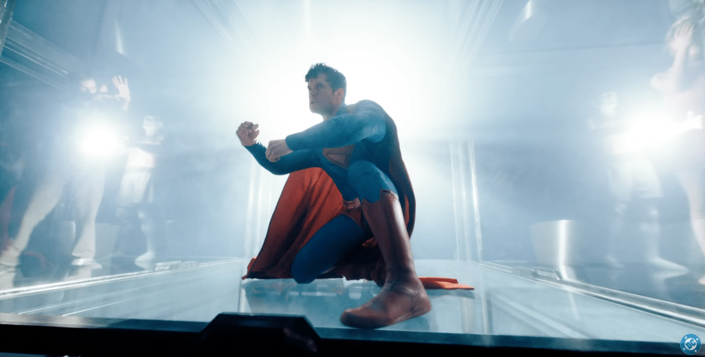Superman prepares to punch a glass cage.