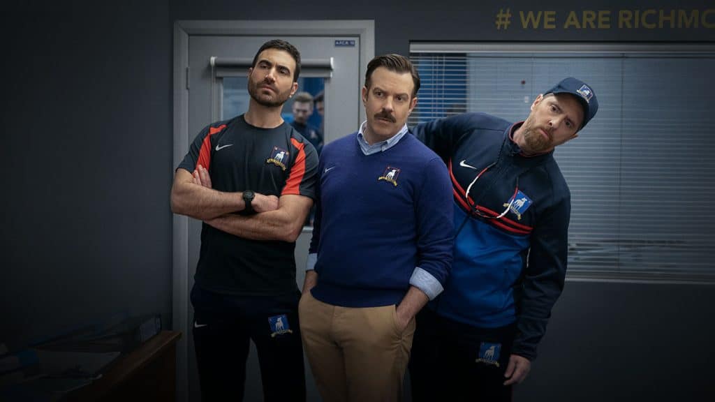 Roy, Ted, and Beard stand together looking at something off screen