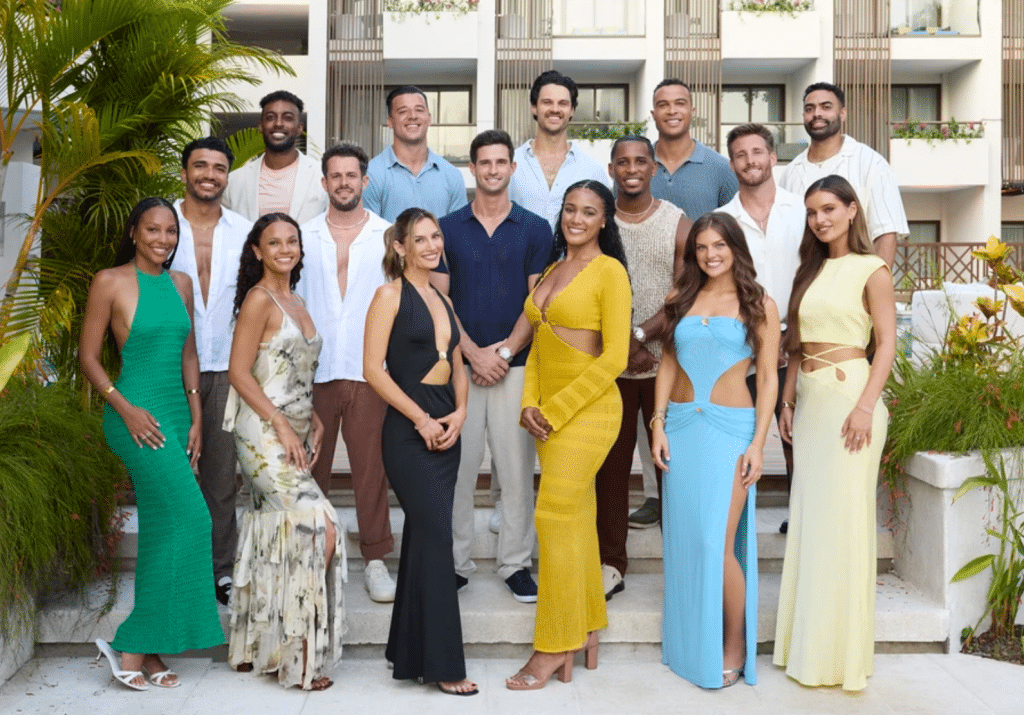16 contestants pose for a group photo in the Bachelor in Paradise villa