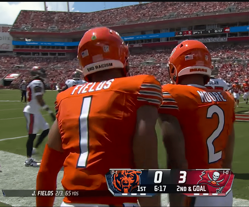 Justin Fields celebrates with a teammate after scoring a touchdown (NFL/YouTube)