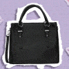 A black purse being accessorized with charms on a purple background.