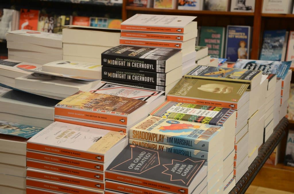 A table spread of books at a bookstore.