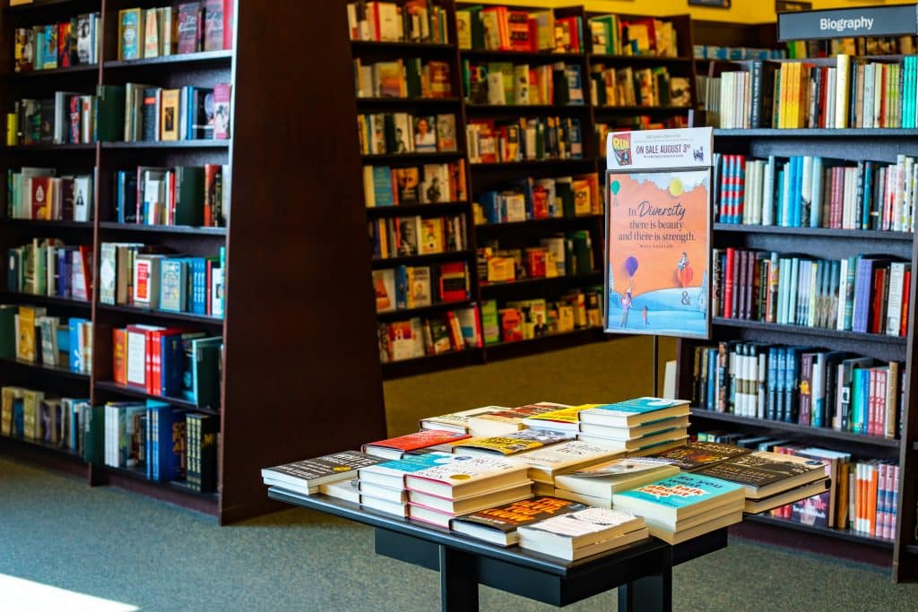 A Bookstore with a table display full of summer books.