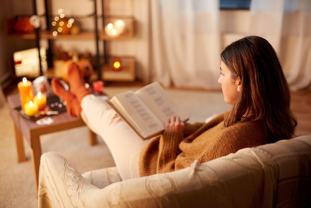 Woman sitting in a chair reading
