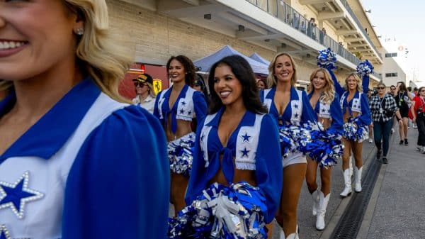 Dallas Cowboys Cheerleaders walking onto the football pitch