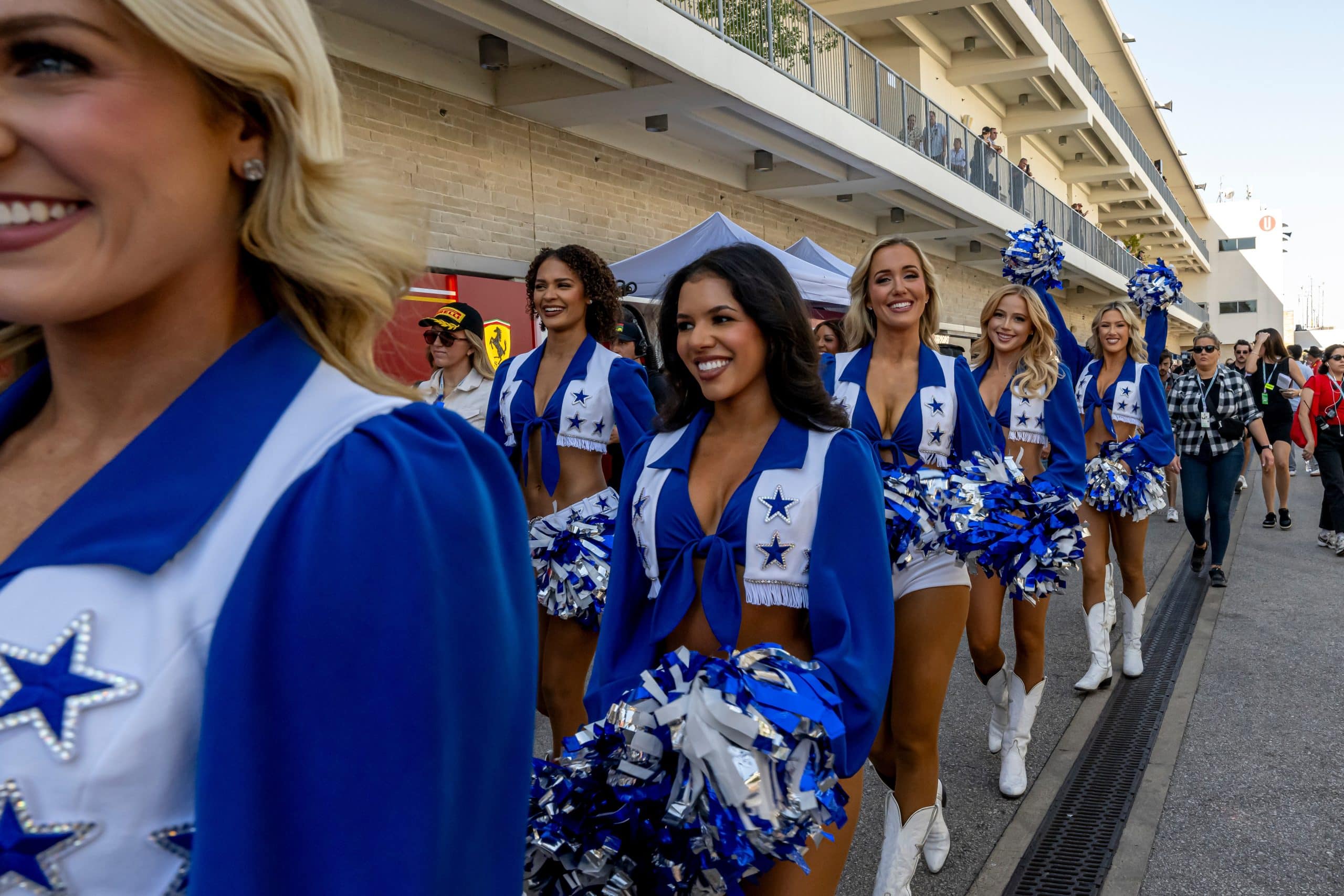 Dallas Cowboys Cheerleaders walking onto the football pitch