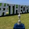 The Claret Jug in front of the lettering at The Open Championship.