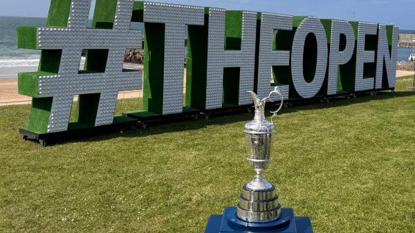 The Claret Jug in front of the lettering at The Open Championship.