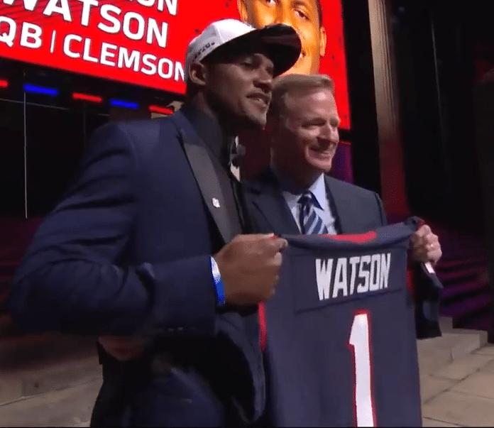 Deshaun Watson poses with NFL Commissioner Roger Goodell after the Houston Texans traded up to select him in the 2017 NFL Draft. (NFL Throwback/YouTube)