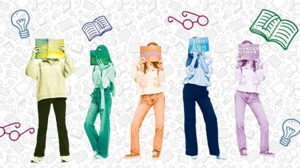 Image depicts five woman standing with books covering their faces.