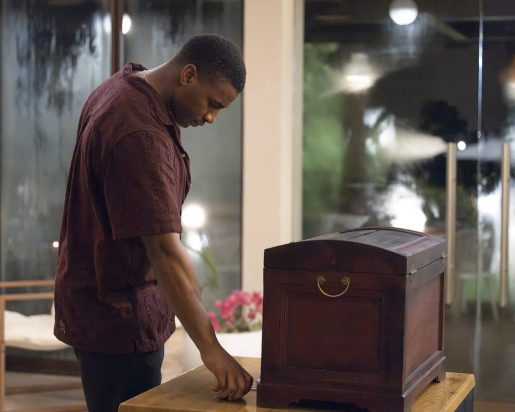Andrew places his vote in a treasure chest