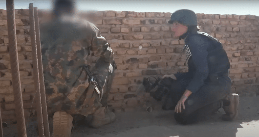DW correspondent Mariel Müller filming a documentary on the war in 2023, accompanied by an SAF soldier. Credit: DW Documentary (youtube)