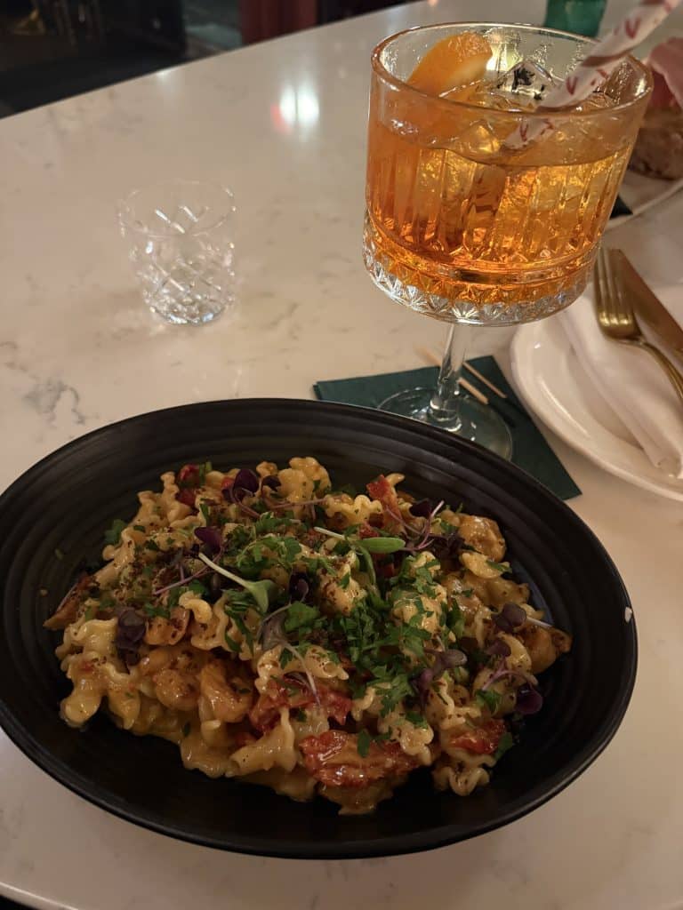 The campanelle pasta and large glass of Aperol spritz from Via Vecchia.