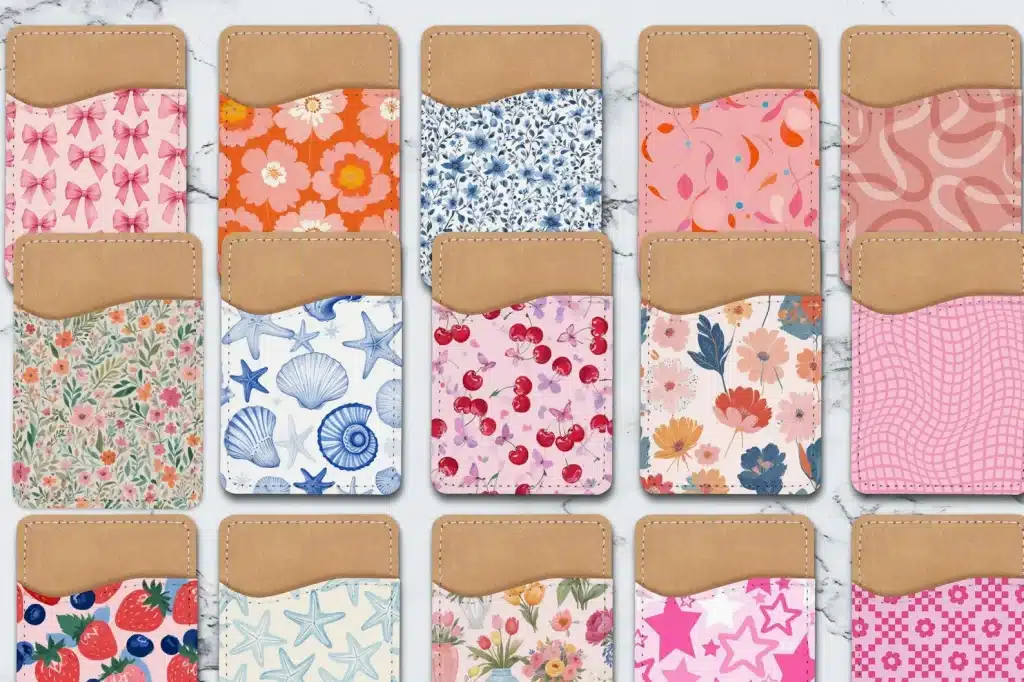 15 stick-on phone wallets with various colorful designs, including seashells, flowers, cherries, and stars.
