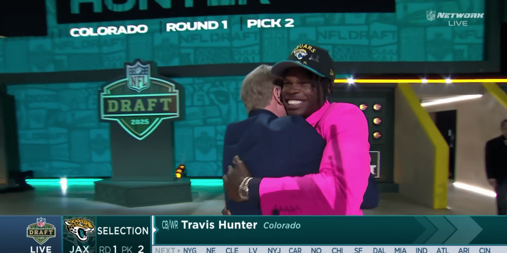 Travis Hunter celebrates being drafted by the Jaguars with Commissioner Roger Goodell.