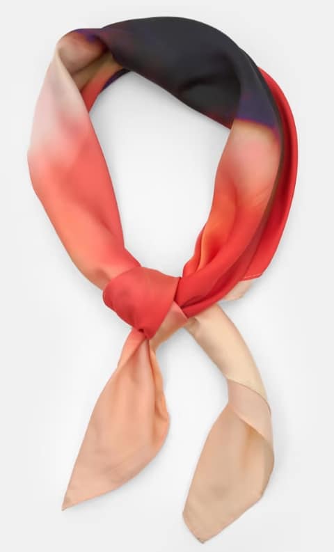 An red, black and cream ombre-effect bandanna laid out on a white background. (Credit: Asos)