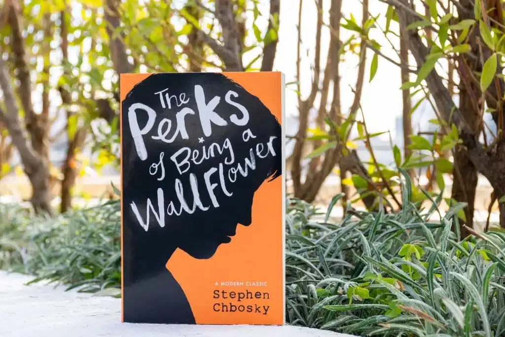 The Perks of Being a Wallflower novel posed alongside foliage.
