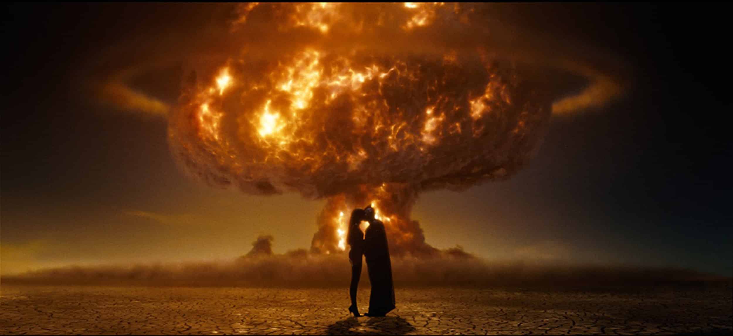 Nite Owl and Silk Spectre kissing with an atomic bomb exploding in the background.