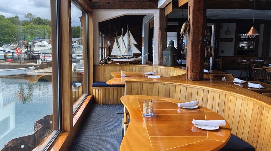 View overlooking the water in the indoor dining area at Arundel Wharf Restaurant in Maine