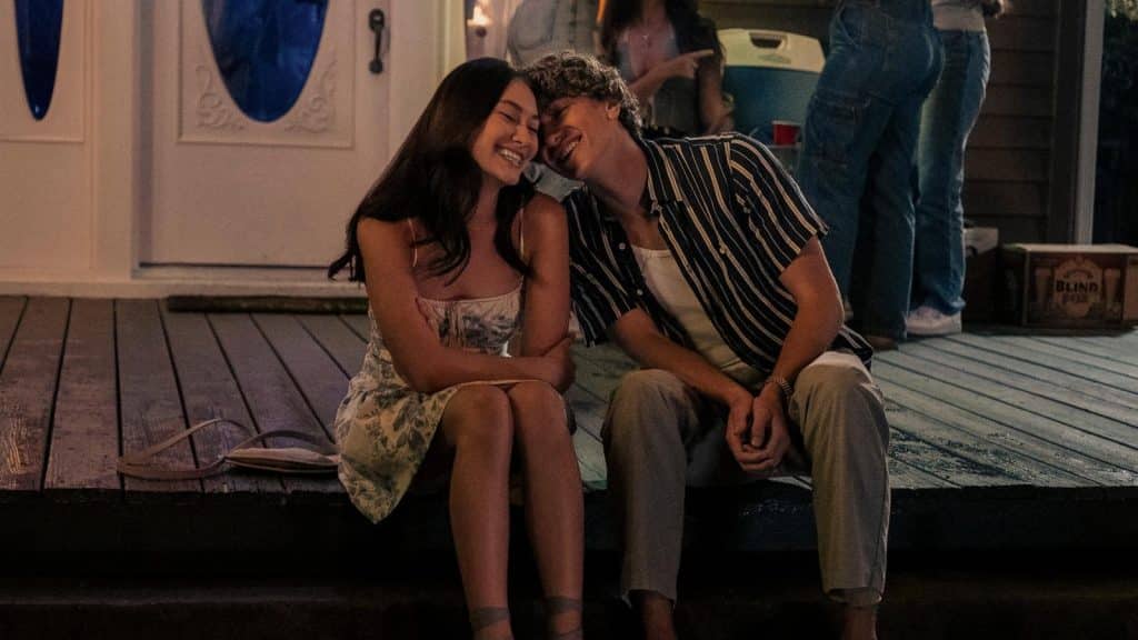 Belly (Lola Tung) and Jeremiah (Gavin Casalegno) sit side by side at a Finch College party.
