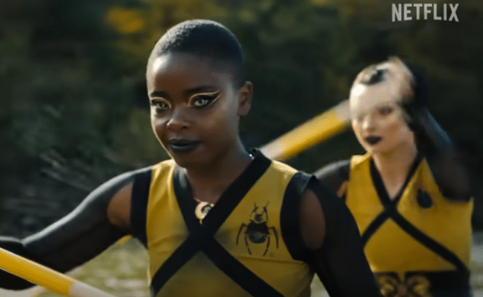 A girl rowing in a boat.
