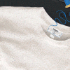 Animated GIF showing a series of men's tops. Each frame displays a different shirt in a minimalist, flat-lay format, with visible stitching details and brand labels. A sewing needle and blue thread animate across the screen, emphasizing craftsmanship and subtle branding.