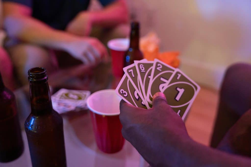 A hand holding Uno cards